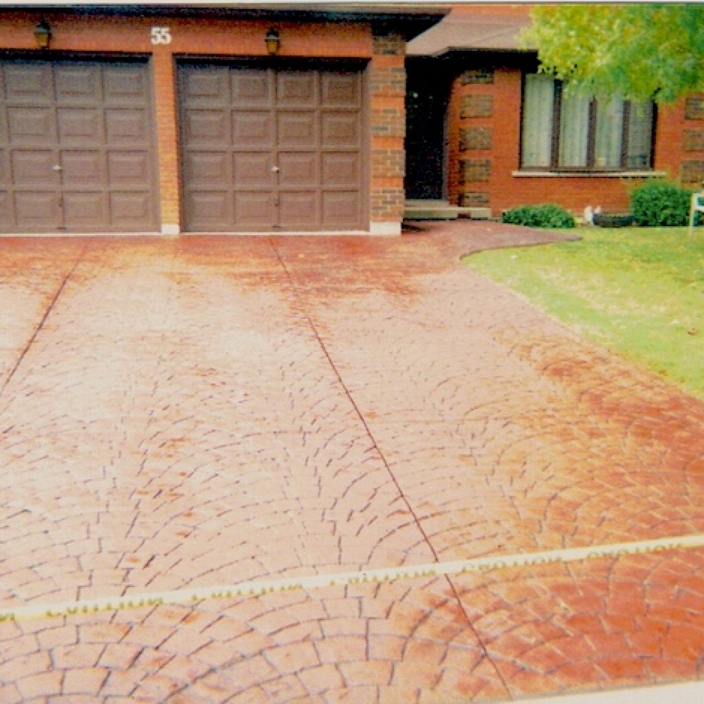 Restored interlock driveway in front of a home